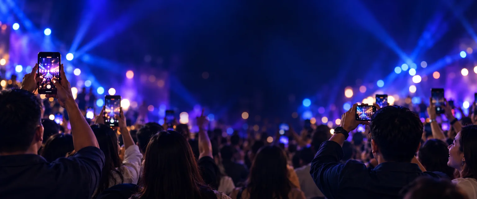 A crowd capturing a celebration on their phones